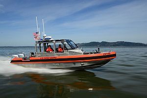 coast guard uses kayak to rescue 2 from grounded boat near